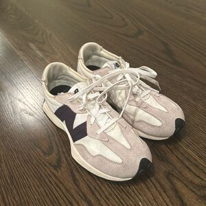 Beige, white, and black New Balance 327